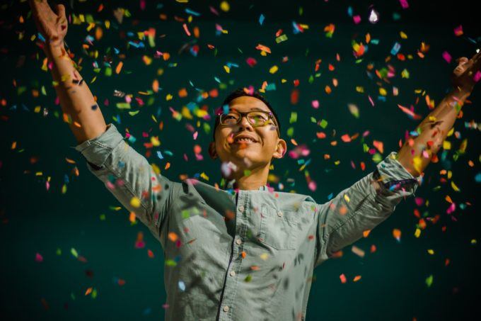 man celebrating with confetti